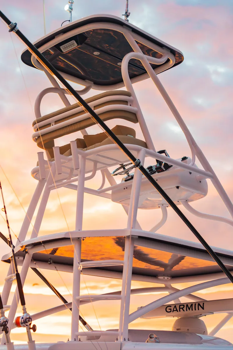 Slide: The Image of Phenom 43 boat tower against a sunset sky, 2025 model. - 8