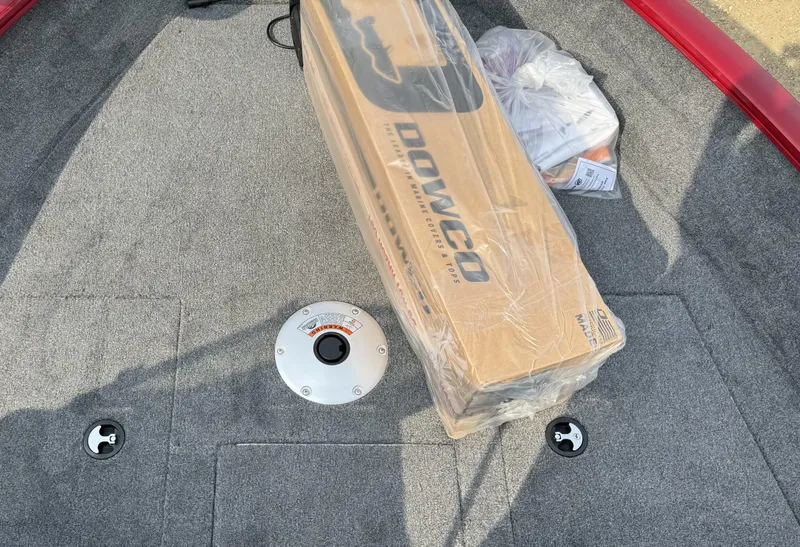 Slide: The Image of 2025 Tracker Pro Guide V-175 WT boat interior with packaged Dowco accessory. - 12