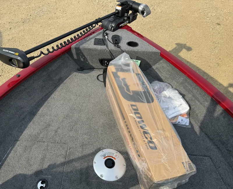 Slide: The Image of 2025 Tracker Pro Guide V-175 WT boat deck with equipment and packaging. - 13