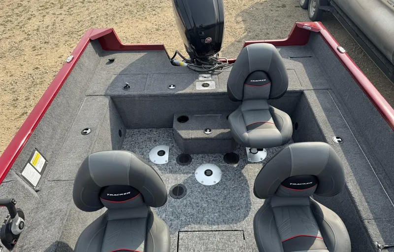 Slide: The Image of 2025 Tracker Pro Guide V-175 WT boat interior with four seats and motor. - 15