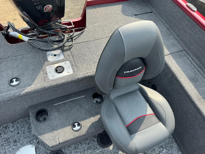 Slide: The Image of 2025 Tracker Pro Guide V-175 WT boat interior with gray seating and motor. - 17