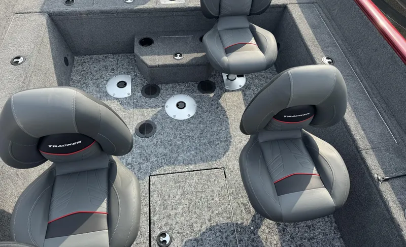 Slide: The Image of 2025 Tracker Pro Guide V-175 WT boat interior with gray seating and carpeted floor. - 7