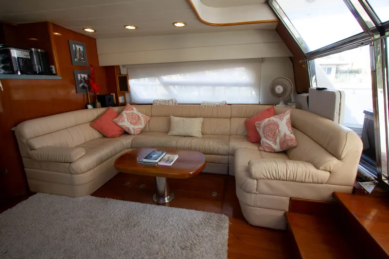 Slide: The Image of Luxurious interior of 1999 Johnson 70 Motor Yacht with plush seating and elegant decor. - 17