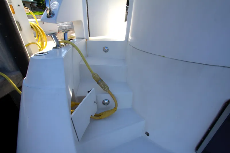Slide: The Image of Steps on a 1999 Johnson 70 Motor Yacht with visible yellow power cables. - 3