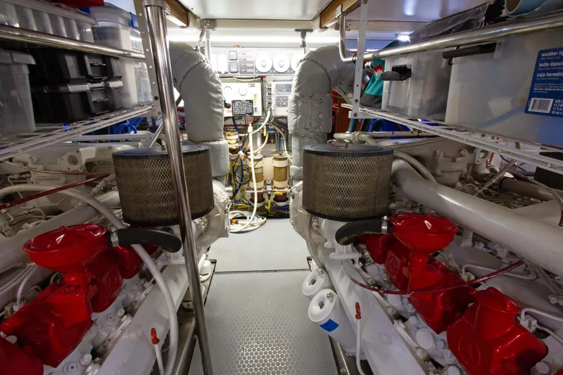 Slide: The Image of Engine room of 1999 Johnson 70 Motor Yacht with dual engines and control systems. - 32