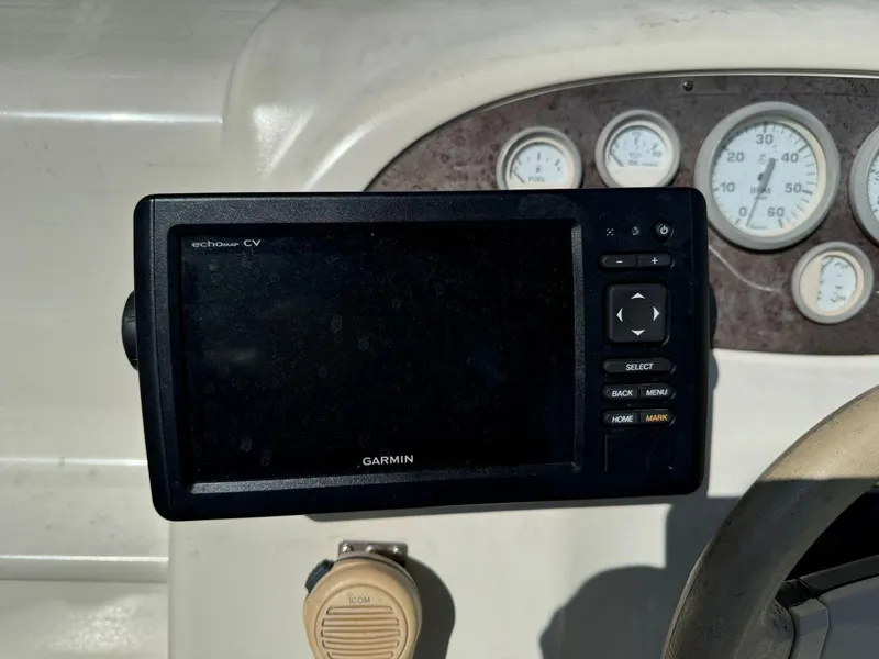 Slide: The Image of Garmin GPS device on 1996 Sea Ray 215 Express Cruiser dashboard. - 16