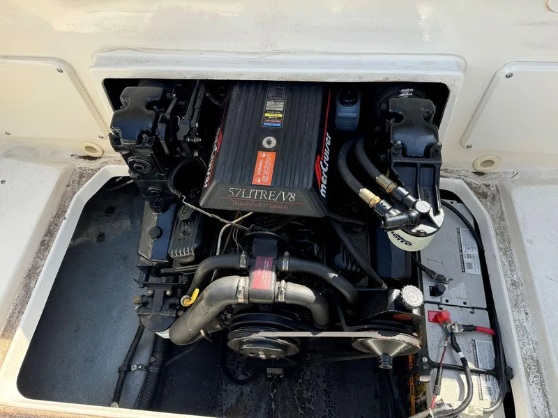 Slide: The Image of Engine compartment of a 1996 Sea Ray 215 Express Cruiser with 5.7L V8 engine. - 23