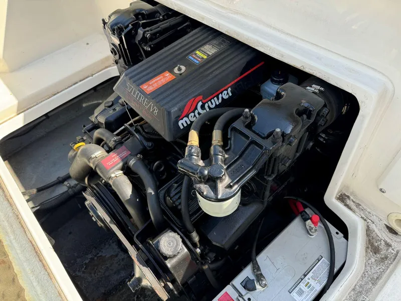 Slide: The Image of 1996 Sea Ray 215 Express Cruiser engine compartment with MerCruiser engine. - 25
