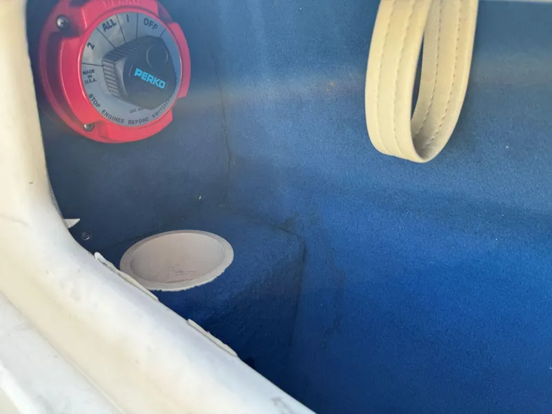 Slide: The Image of Battery switch inside 1996 Sea Ray 215 Express Cruiser boat compartment. - 26