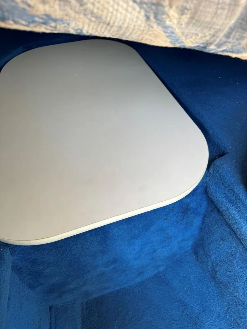 Slide: The Image of Interior of 1996 Sea Ray 215 Express Cruiser with blue upholstery and table. - 32