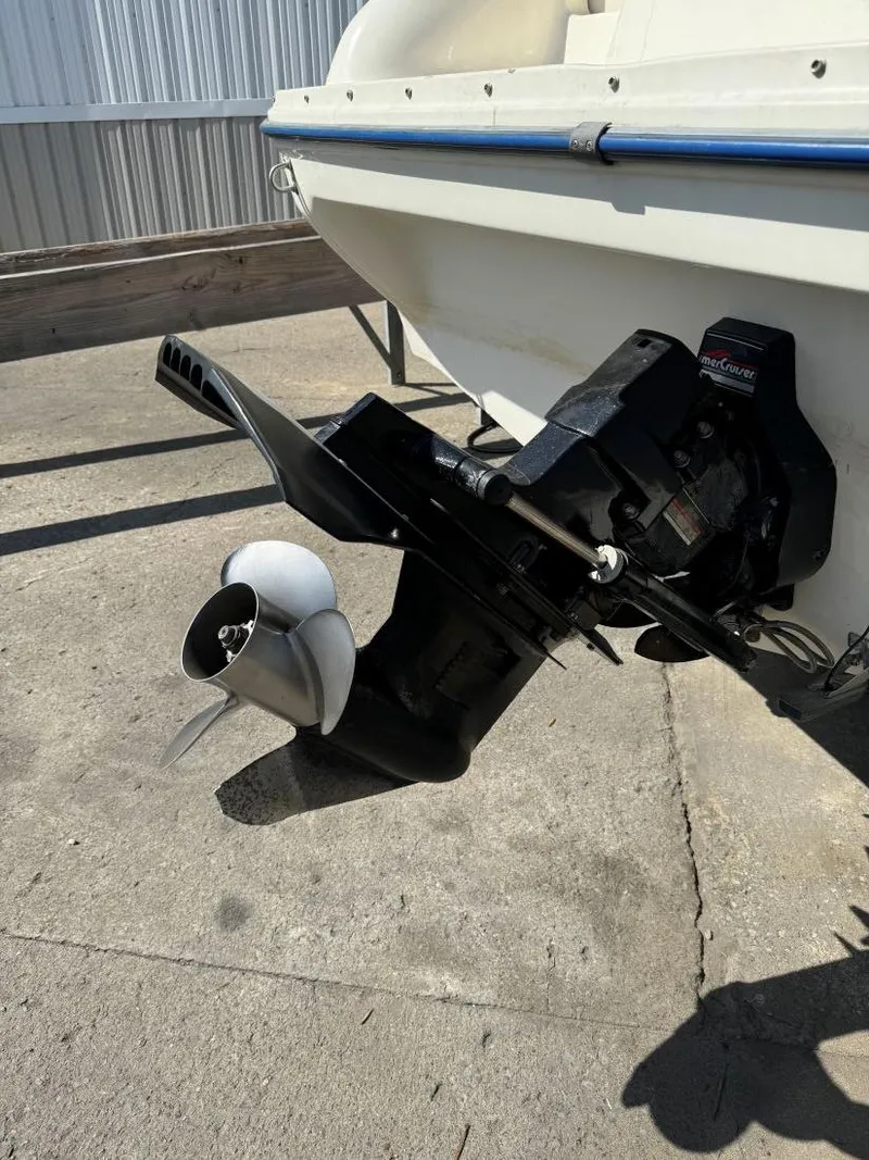 Slide: The Image of 1996 Sea Ray 215 Express Cruiser boat propeller and stern drive detail. - 9
