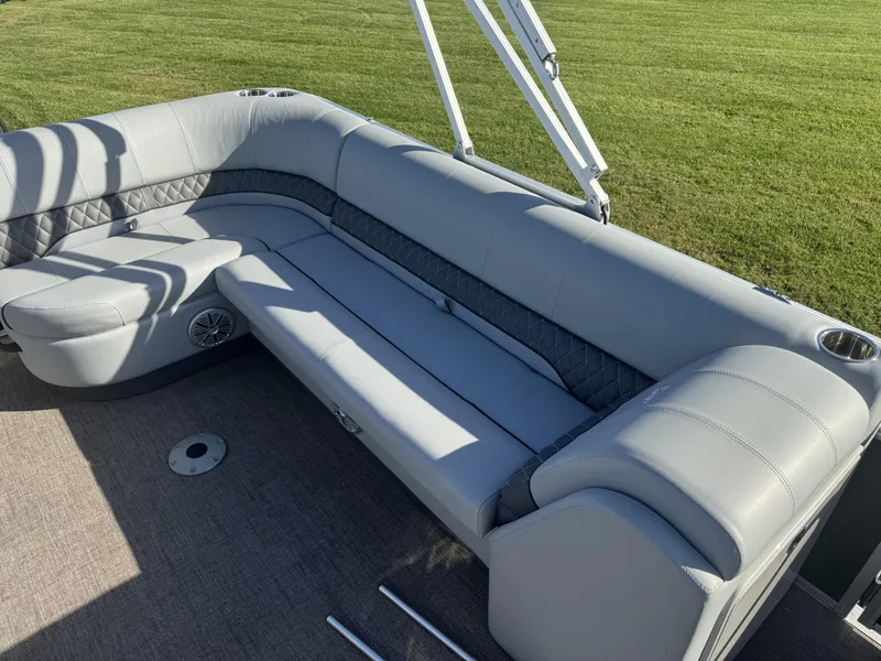 Slide: The Image of 2019 Ranger Reata 223C boat interior with gray seating and cup holders. - 6