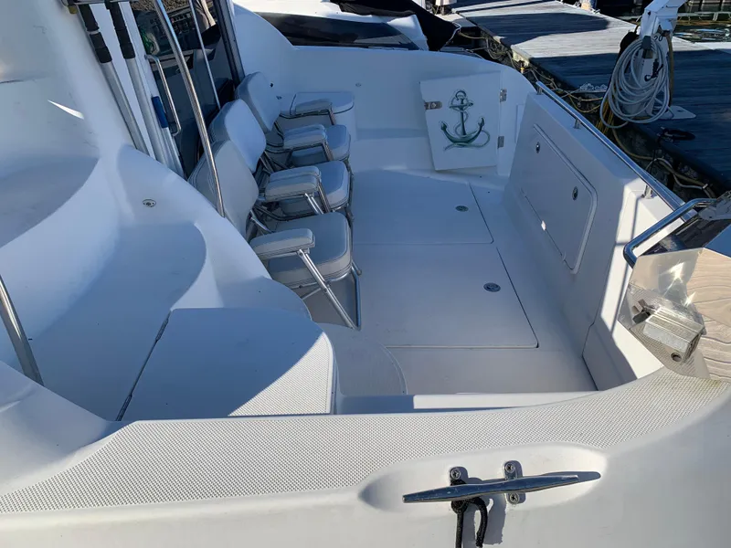 Slide: The Image of 2006 Meridian 459 Motoryacht deck with seating and anchor design. - 1