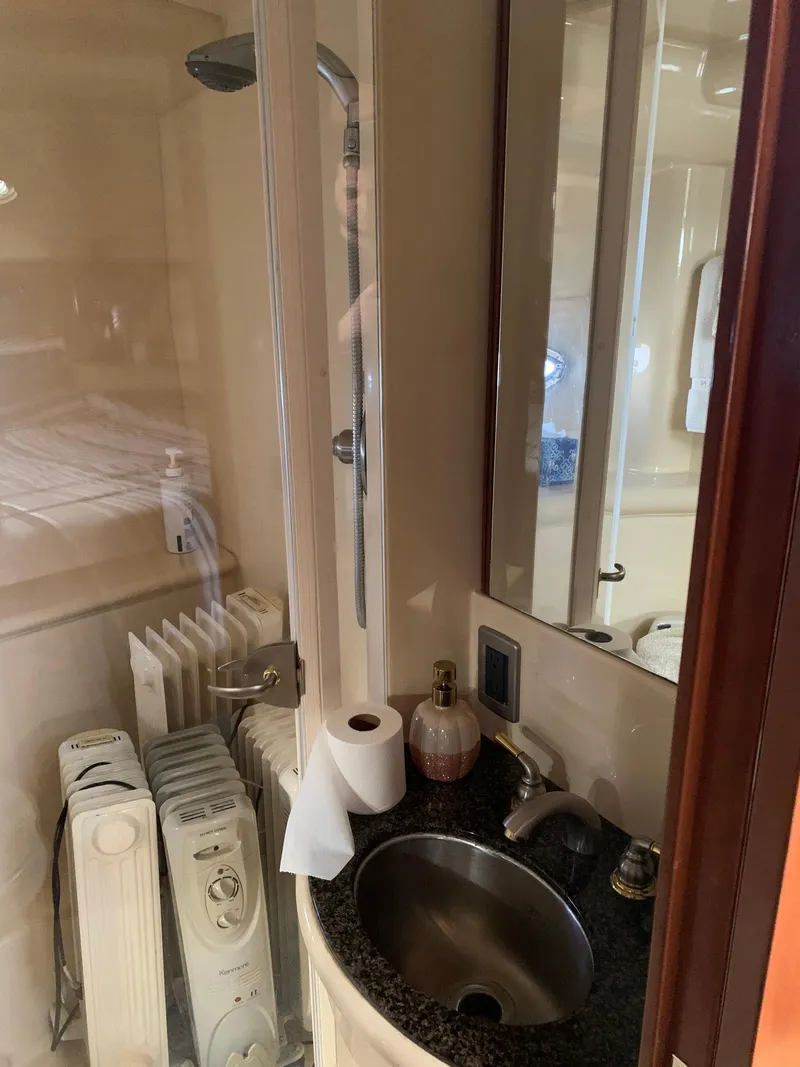 Slide: The Image of 2006 Meridian 459 Motoryacht bathroom with sink, shower, and heater. - 13