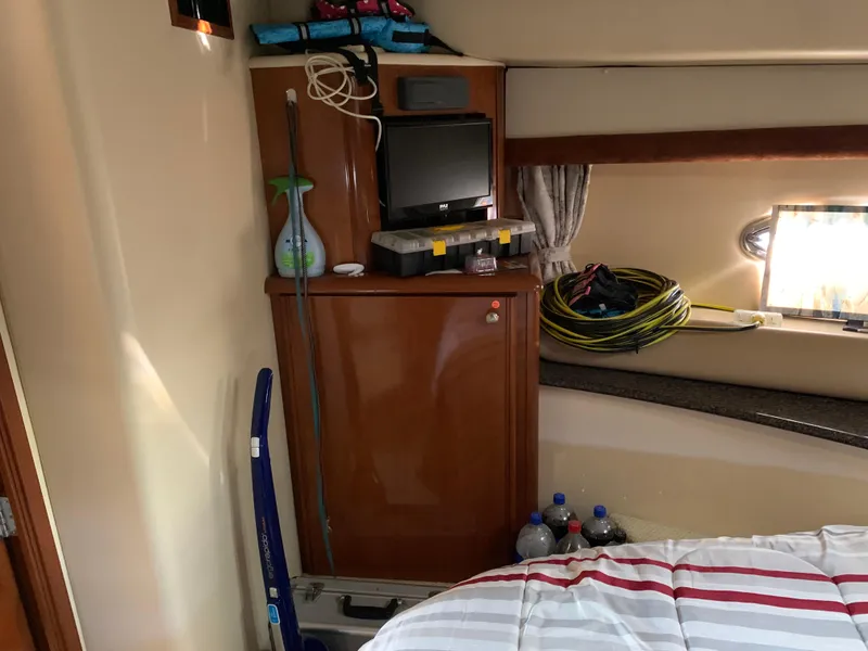 Slide: The Image of Interior of 2006 Meridian 459 Motoryacht with TV, fridge, and bed. - 15
