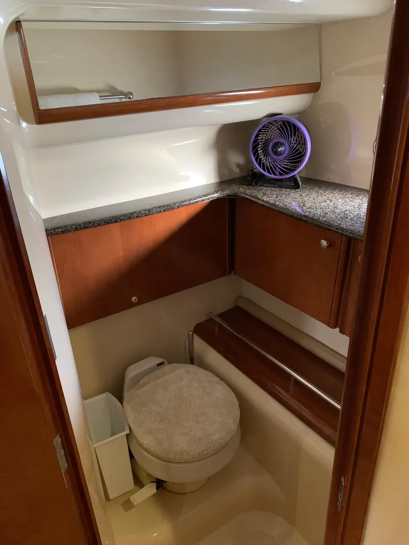 Slide: The Image of 2006 Meridian 459 Motoryacht bathroom with granite countertop and compact toilet. - 18