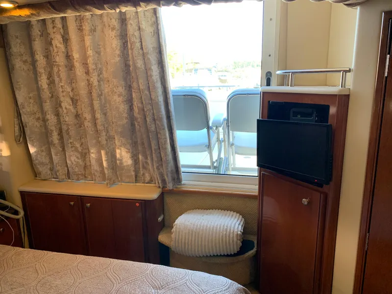 Slide: The Image of Interior of 2006 Meridian 459 Motoryacht with window, TV, and cozy furnishings. - 19