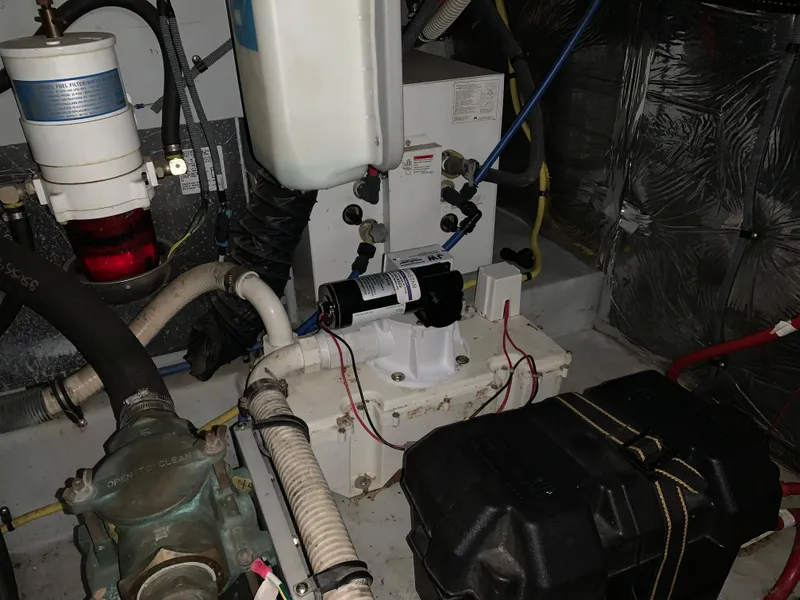 Slide: The Image of Engine room of 2006 Meridian 459 Motoryacht with various mechanical components. - 21