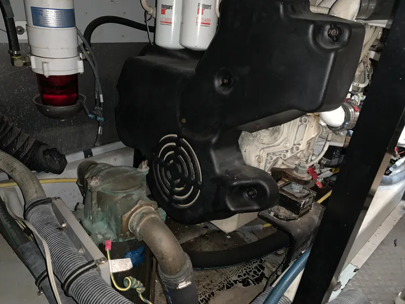 Slide: The Image of Engine compartment of 2006 Meridian 459 Motoryacht, showcasing mechanical components and filters. - 22