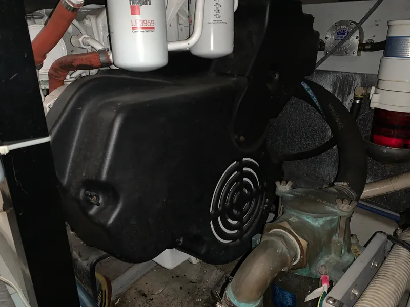 Slide: The Image of Engine room of 2006 Meridian 459 Motoryacht with visible components and filters. - 23