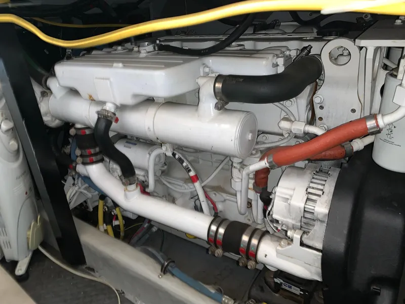 Slide: The Image of Engine compartment of a 2006 Meridian 459 Motoryacht, showcasing detailed mechanical components. - 24