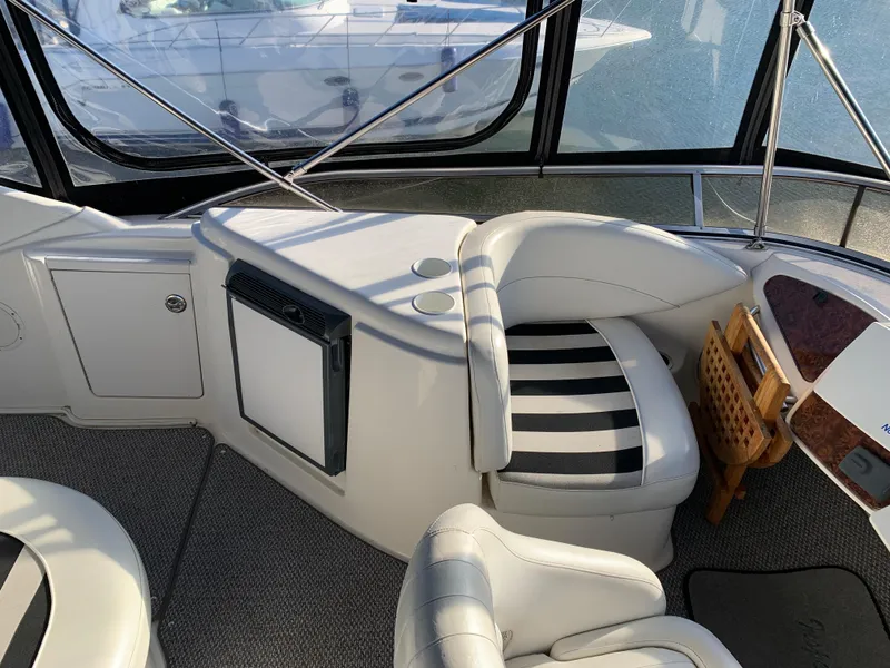 Slide: The Image of Interior of 2006 Meridian 459 Motoryacht with striped seating and modern amenities. - 3