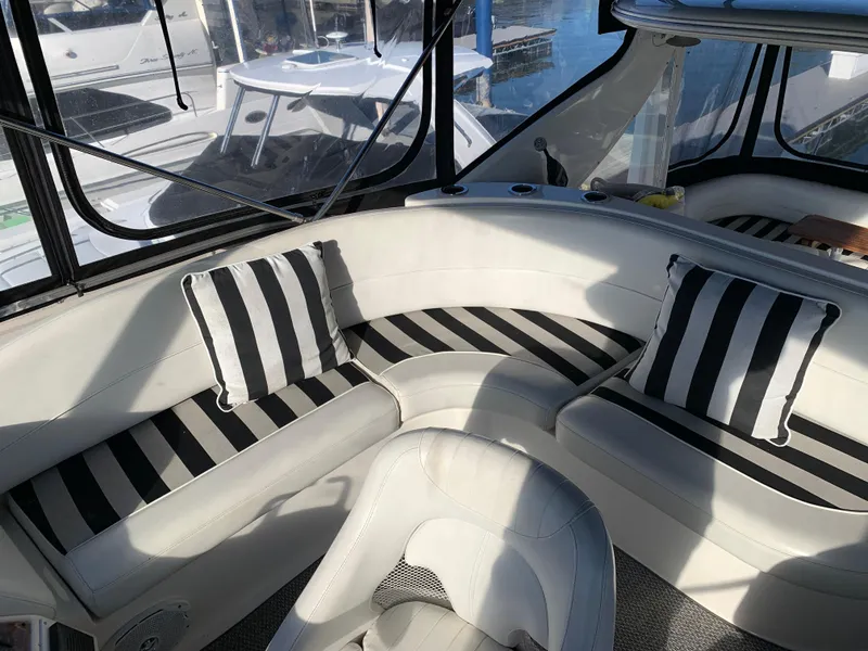Slide: The Image of Interior of 2006 Meridian 459 Motoryacht with striped cushions and seating area. - 4
