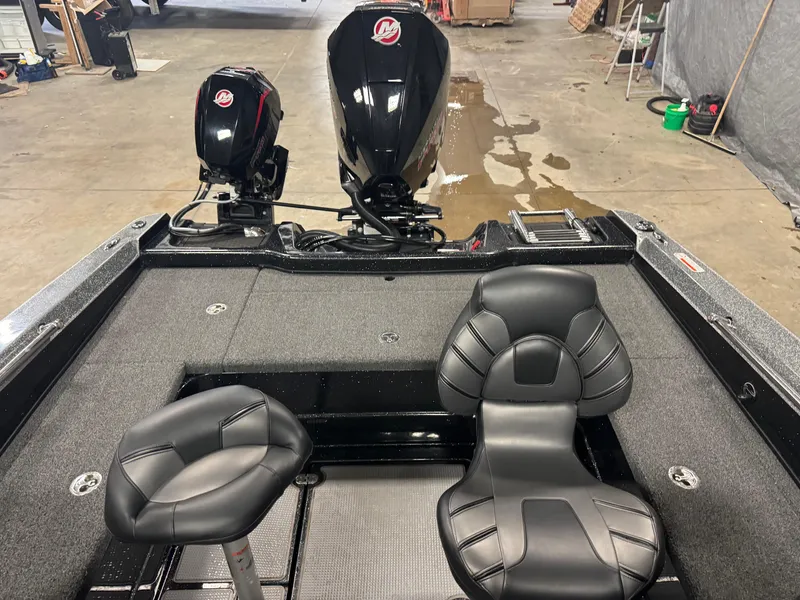 Slide: The Image of 2022 Nitro ZV20 boat interior with dual seats and outboard motors in a garage setting. - 11