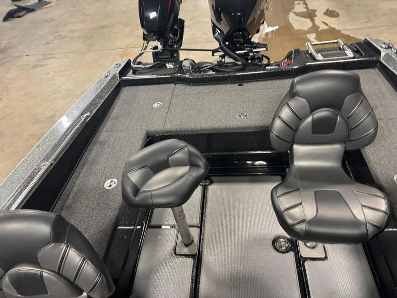 Slide: The Image of 2022 Nitro ZV20 boat interior with black leather seats and dual motors. - 12
