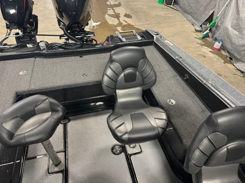 Slide: The Image of 2022 Nitro ZV20 boat interior with black cushioned seats and dual motors. - 14