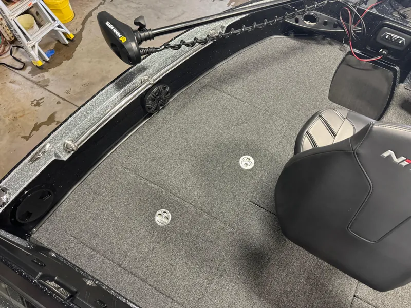 Slide: The Image of 2022 Nitro ZV20 boat interior with gray carpet and black seat. - 20