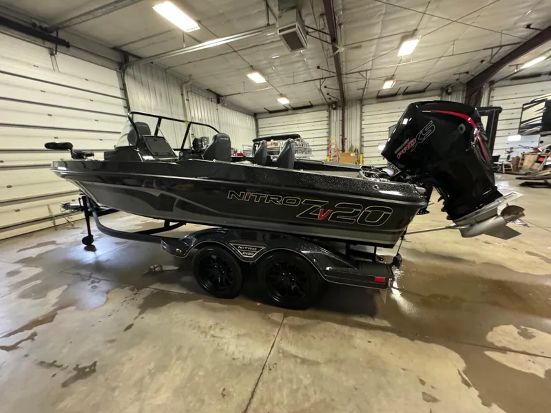 Slide: The Image of 2022 Nitro ZV20 boat in a garage, featuring sleek design and powerful engine. - 6