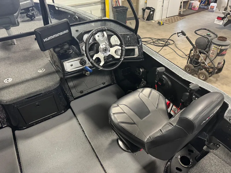 Slide: The Image of Interior of 2022 Nitro ZV20 boat with steering wheel and Humminbird electronics. - 8