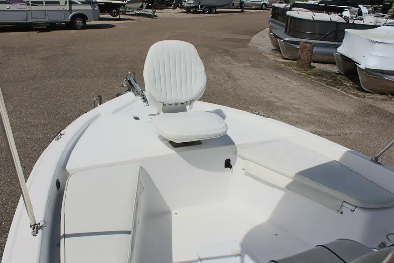 Slide: The Image of 2002 Cobia 191 Bay boat with white seating and spacious deck. - 17
