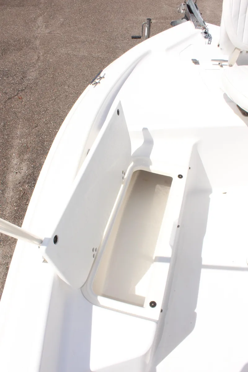 Slide: The Image of 2002 Cobia 191 Bay boat deck with storage compartment. - 18
