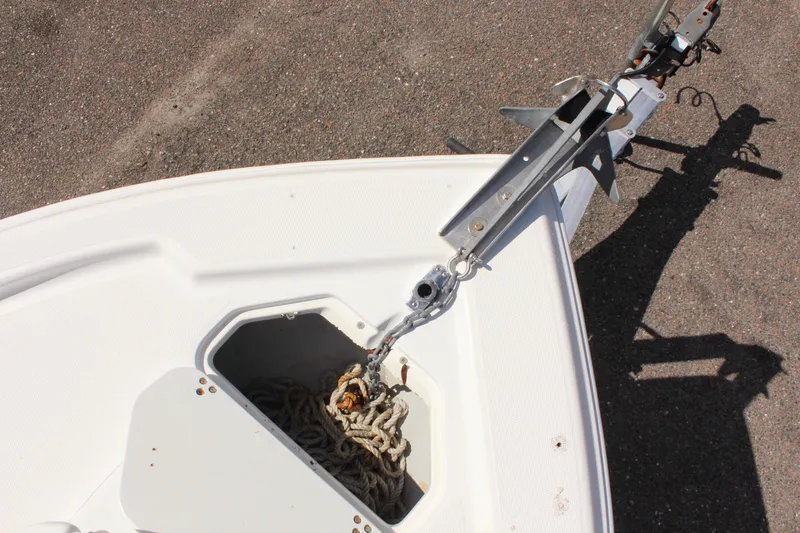 Slide: The Image of 2002 Cobia 191 Bay boat trailer hitch and anchor storage. - 22