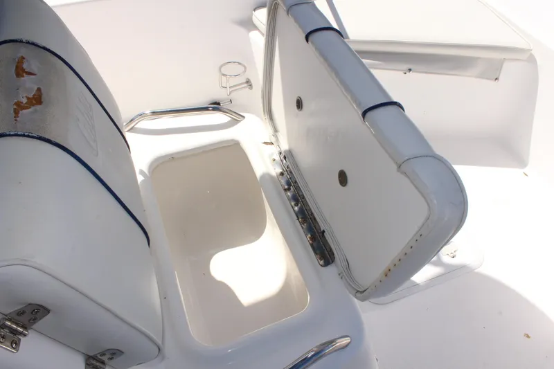 Slide: The Image of Open storage compartment on 2002 Cobia 191 Bay boat interior. - 26