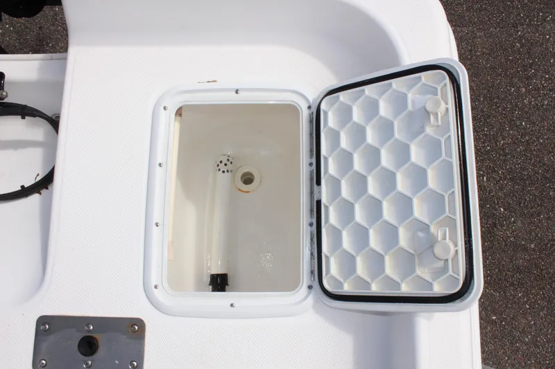 Slide: The Image of Open storage compartment on 2002 Cobia 191 Bay boat deck. - 9