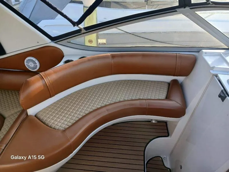 Slide: The Image of Luxurious seating on 2002 Regal Commodore 3060 boat with brown leather and quilted design. - 10