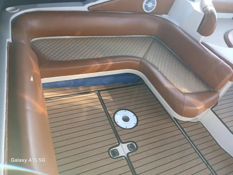 Slide: The Image of Brown leather seating on 2002 Regal Commodore 3060 boat deck. - 12