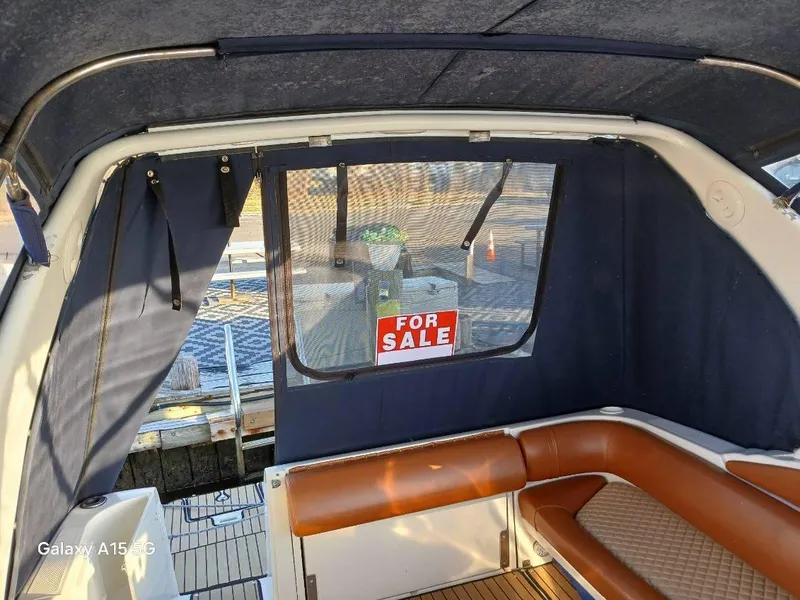 Slide: The Image of 2002 Regal Commodore 3060 boat interior with "For Sale" sign. - 13