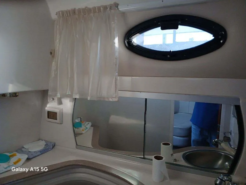 Slide: The Image of Bathroom interior of 2002 Regal Commodore 3060 yacht with sink and mirror. - 15