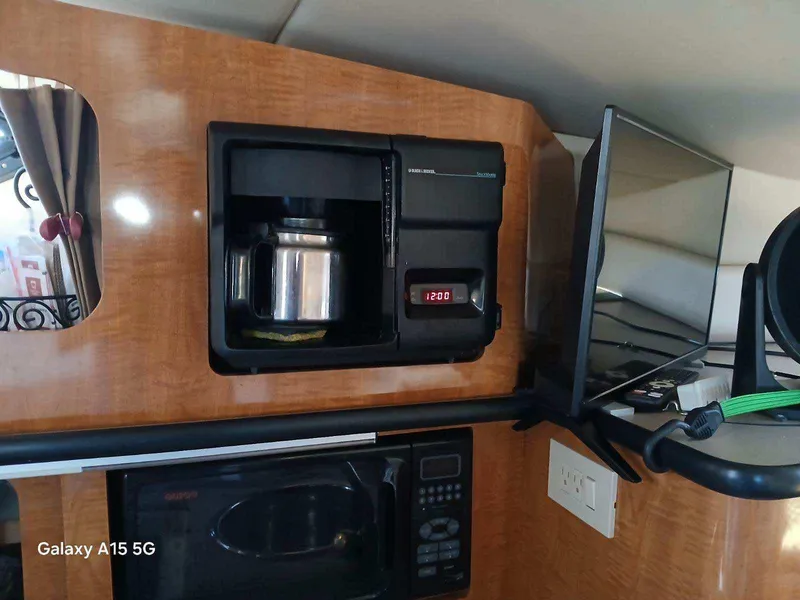Slide: The Image of 2002 Regal Commodore 3060 interior with coffee maker and microwave. - 26