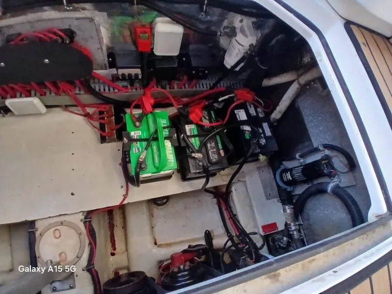 Slide: The Image of Engine compartment of 2002 Regal Commodore 3060 with batteries and wiring. - 39