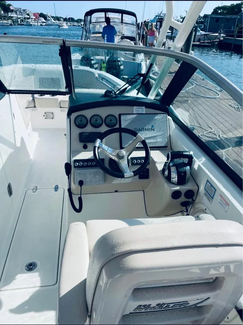 Slide: The Image of Helm pod with new (2022) Garmin dispaly and Garmin VHF - 4