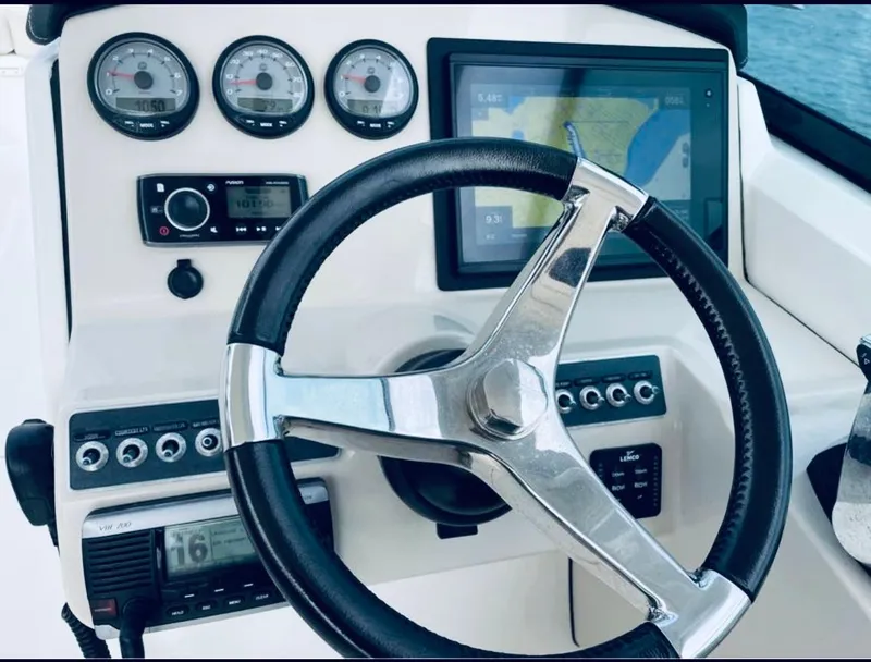 Slide: The Image of Helm Station with New Garmin display and Fusion stereo and Lenco Trim Tabs - 5