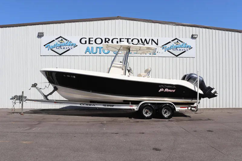 Slide: The Image of 2012 Cobia 256 CC boat on trailer at Georgetown Auto & Marine. - 1