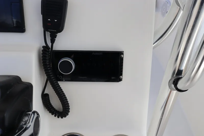 Slide: The Image of Boat dashboard with radio and microphone, Cobia 256 CC, 2012 model. - 13