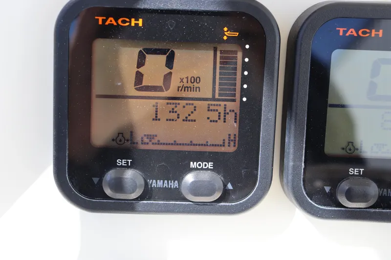 Slide: The Image of Yamaha tachometer display on 2012 Cobia 256 CC boat, showing 132.5 hours. - 14