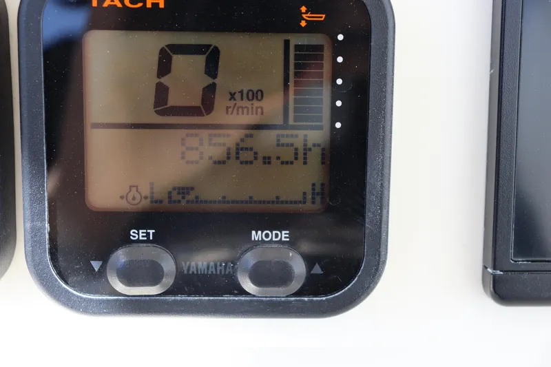 Slide: The Image of Yamaha tachometer display on 2012 Cobia 256 CC boat, showing 856.5 hours. - 15